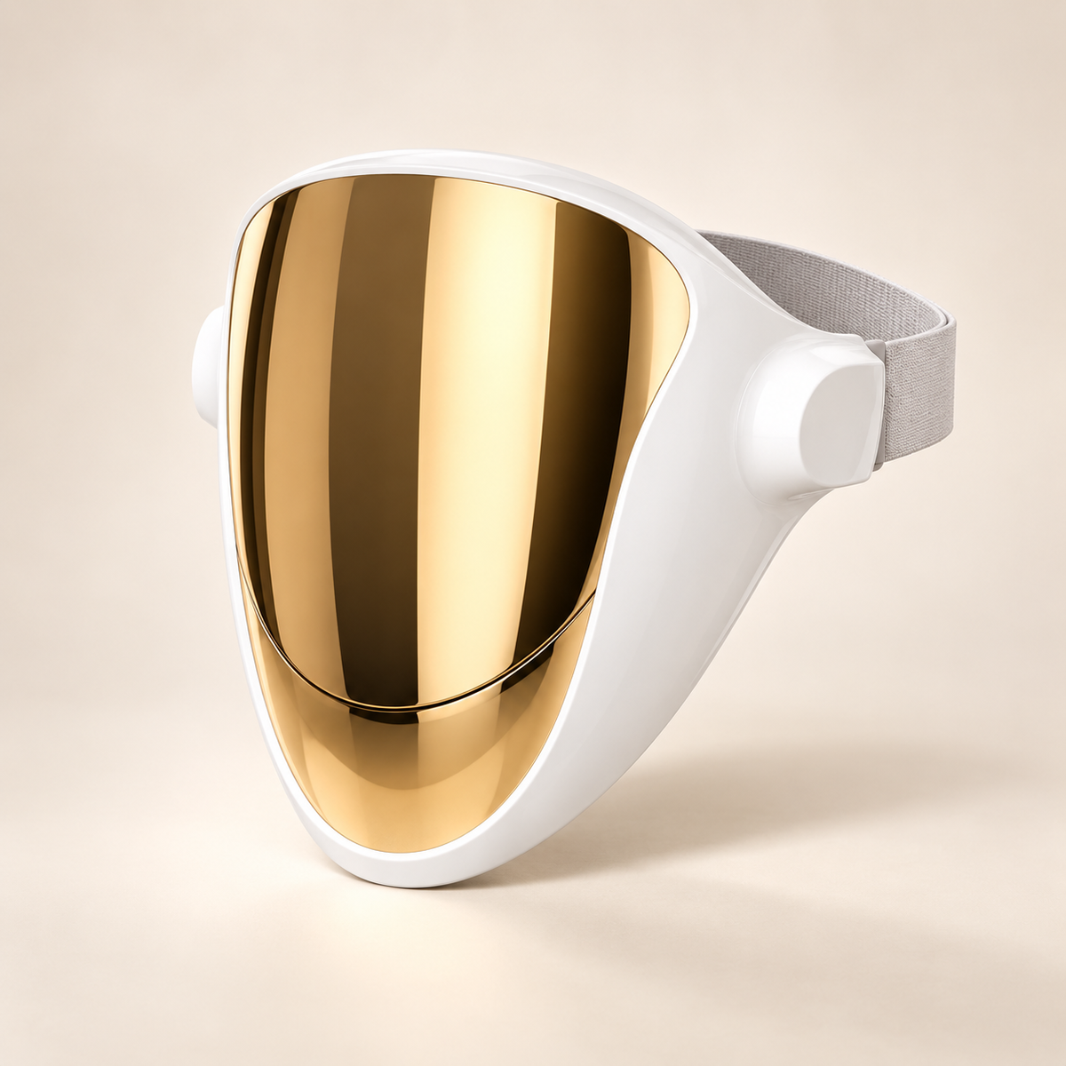 Kroma Glow Mask with a reflective gold faceplate, white frame and grey head strap on a beige background