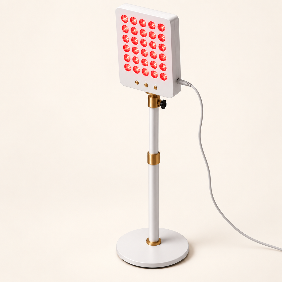 Kroma Glow Pro red light therapy panel illuminated on an adjustable stand with a round base